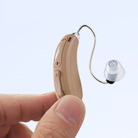 Vivtone Lucid516 RIC hearing aid in hand, beige color